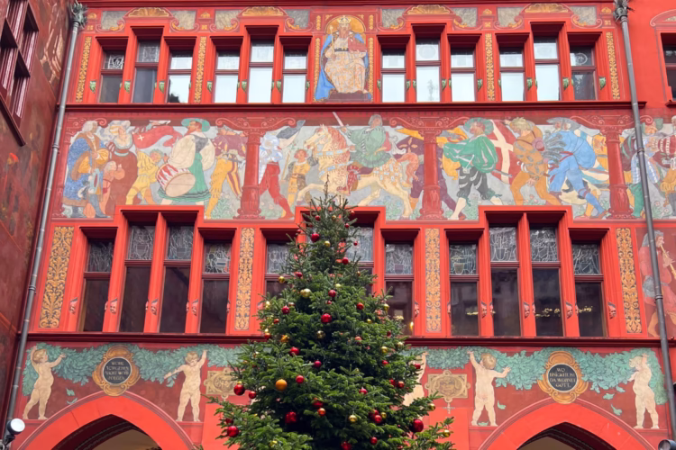 Basel’s historical Rathaus is on the busy Marktplatz (market square) in the center of the old town. The reddish building was built during the early 16th century but restored and enlarged around 1900. Frescoes, mostly with justice as theme, were painted in 1610 by Hans Bock.