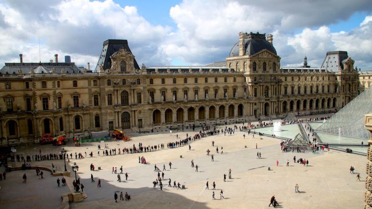 Queues outside the Louvre in Paris. The Paris Museum Pass gives huge discounts and savings on tickets to sights, monuments, palaces, and galleries including the Louvre, D'Orsay, Pompidou, and Versailles.