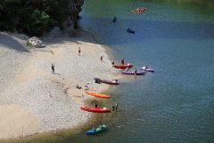 Canoeists at a beach at Pont d’Arc