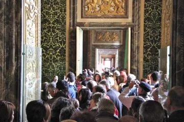The grand state rooms of the Palace of Versailles always seem crowded during the day.