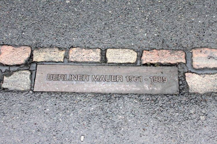 Street markers showing where the Berlin Wall was