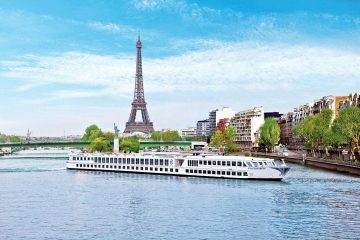 Uniworld River Baroness on the Seine with the Eiffel Tower in the background in Paris
