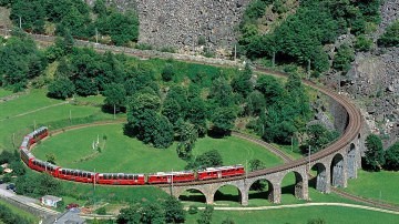 Bernina Express - The Bernina Express crosses the famous Brusio Circular Viaduct.
