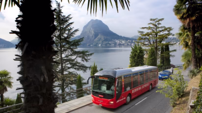 Bernina Express - The Bernina Express Bus provides a link between Tirano and Lugano. Shown here by Lake Lugano