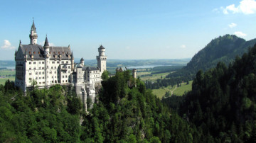 Trains and buses provide cheap public transportation for a day trip from Munich to the Schloss Neuschwanstein Castle in the Bavaria Alps in Germany.