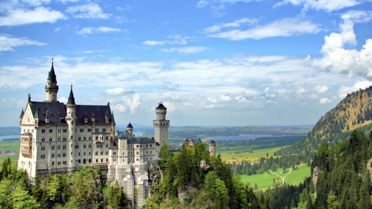 Trains and buses provide cheap public transportation for a day trip from Munich to the Schloss Neuschwanstein Castle in the Bavaria Alps in Germany.