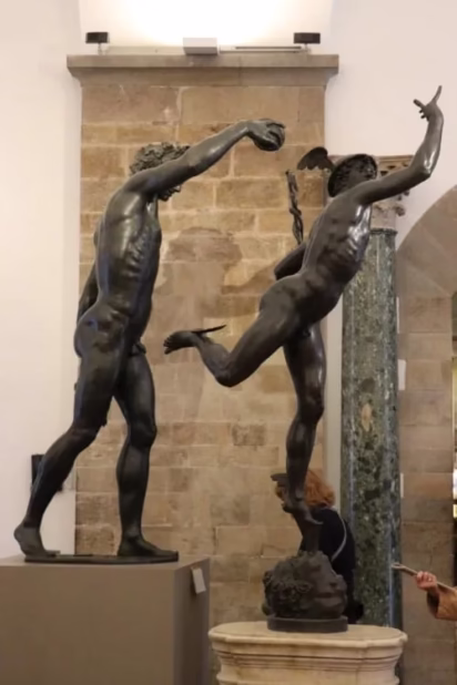 Mercury and Bacchus bronze sculptures in the Bargello Museum of Sculptures in Florence