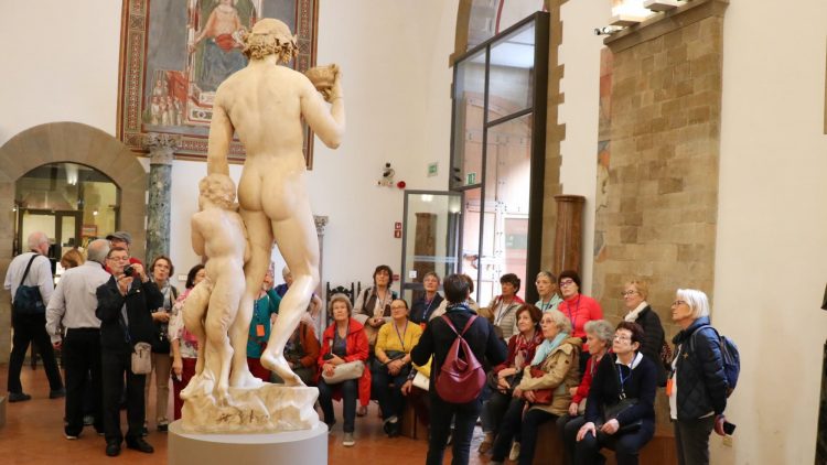 Admiring Michelangelo's Bacchus with satyr sculptures in the Bargello Museum in Florence.
