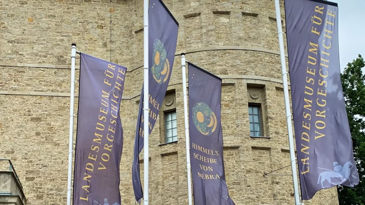 State Museum of Prehistory Halle exterior with banners advertising the sky disc of Nebra