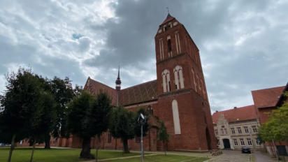 Brick Gothic Güstrower Dom with stormy skies