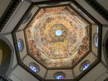 Full cupola ceiling painting by Vasari and stained glass windows in the drum