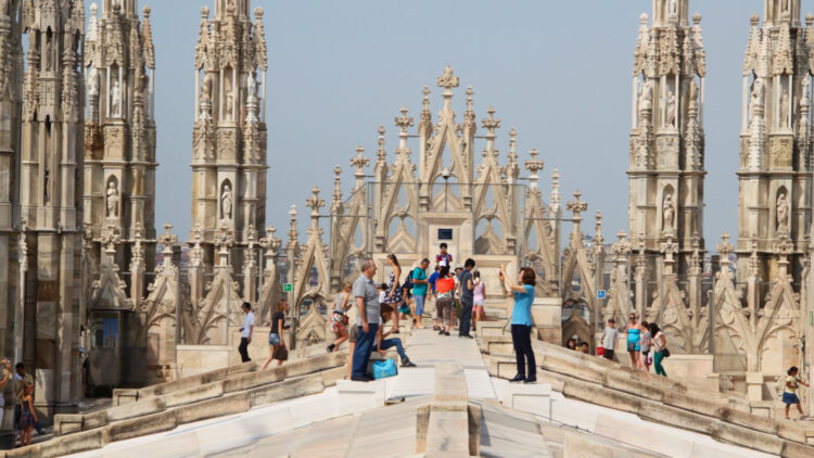 On the Roof of Milan Cathedral Nave
Buy tickets to visit the rooftop terraces of Milan Cathedral — it is 250 stairs (or a short elevator ride) for close-up views of the gargoyles and Gothic spires. 