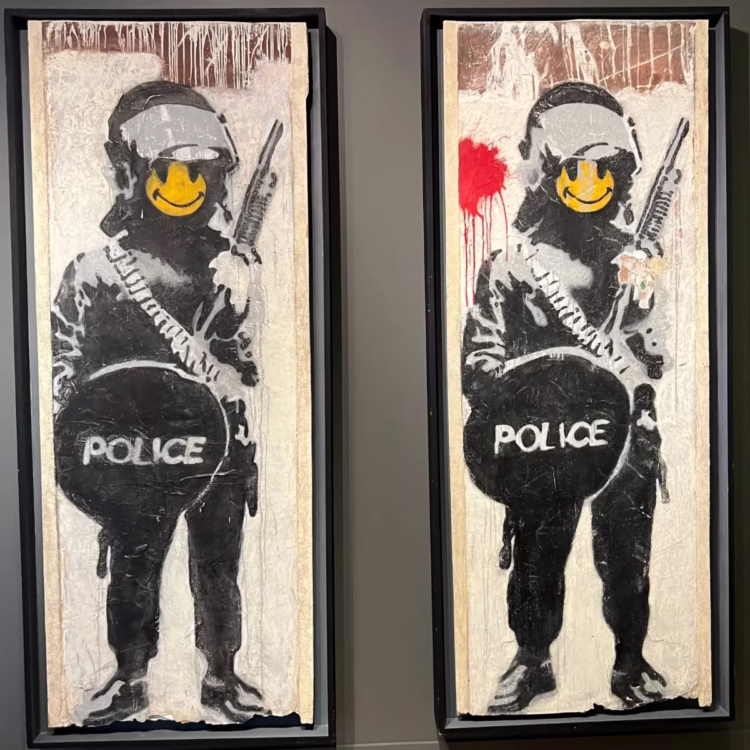 Banksy Smiling Copper in the MOCO Amsterdam Modern and Contemporary Art Museum with Banksy Exhibition.