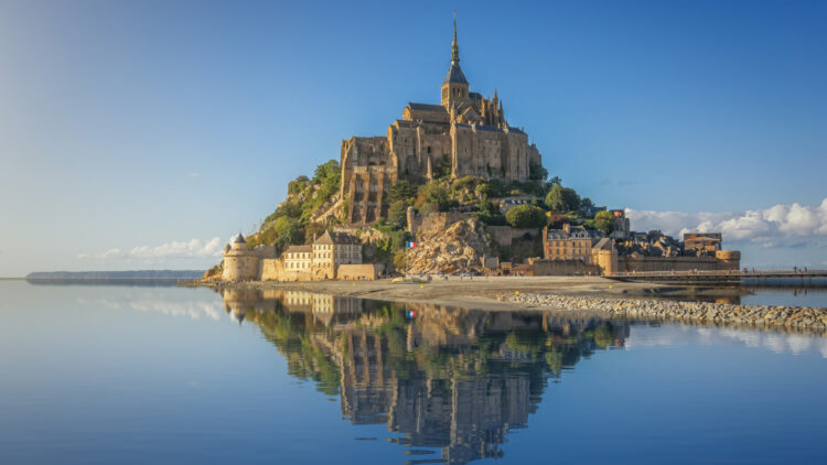 Panoramic view of the island abbey on Le Mont St Michel, one of the top sights to see when visiting Normandy and Brittany in France.