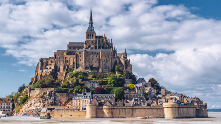 The island abbey on Le Mont St Michel is one of the top sights to see when visiting Normandy and Brittany in France.