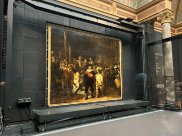 Buy tickets online to visit the Rijksmuseum in Amsterdam and see Rembrandt's The Night Watch that is currently in a large glass box.
