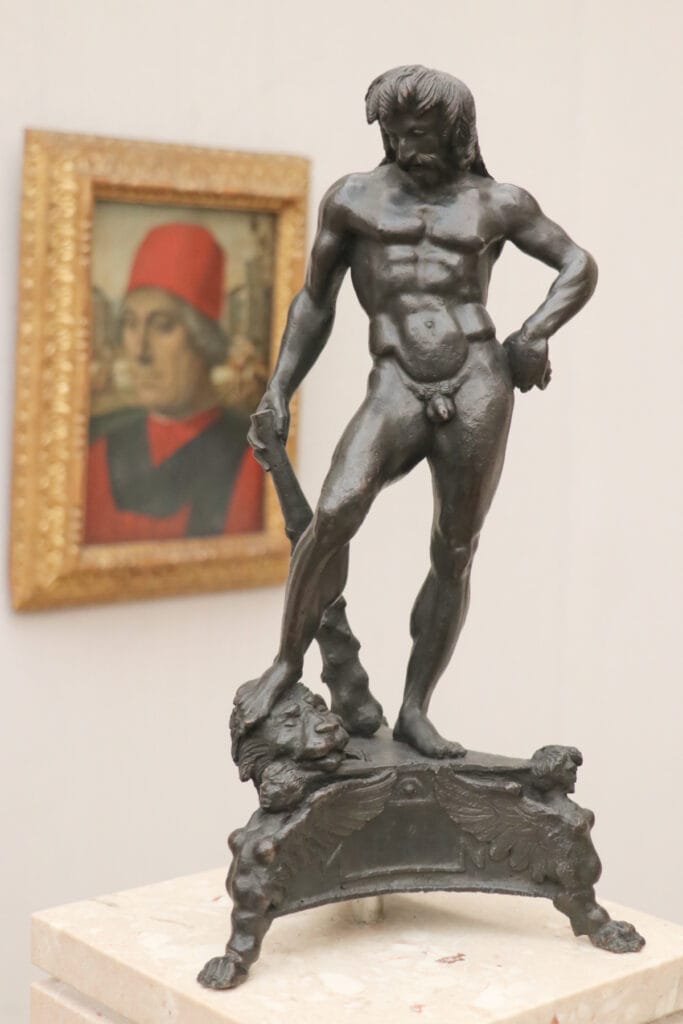Antonio del Pollaiuolo Hercules Sculpture and Luca Signorelli Portrait in the background displayed in Hall VXIII in the Gemäldegalerie in Berlin