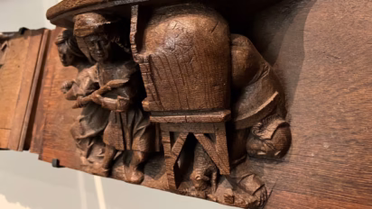 misericord husband dislodges his wife's lover hidden in the oven